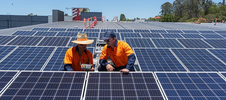 Volteam staff works on solar panel desktop