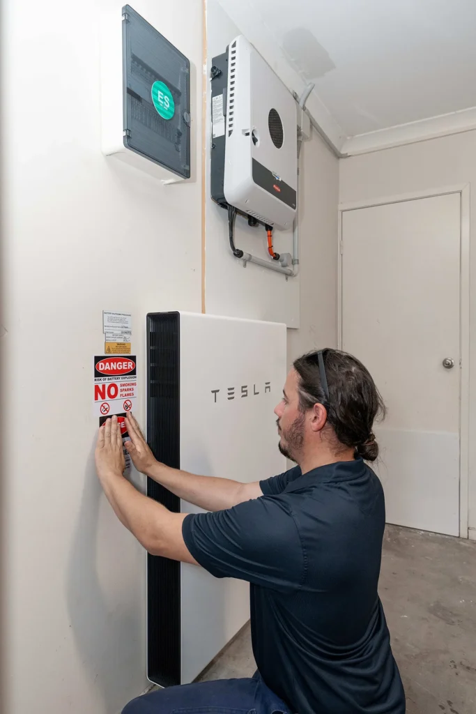 Man working on solar battery installation
