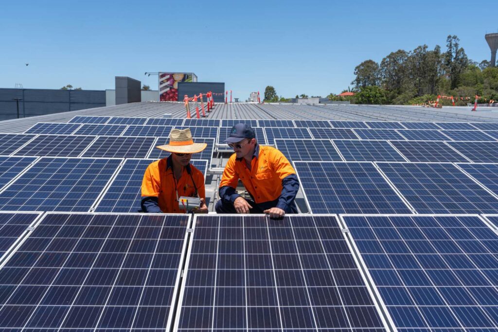 Men working on solar panel installation in Brisbane