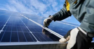 Someone installing solar panels for residential